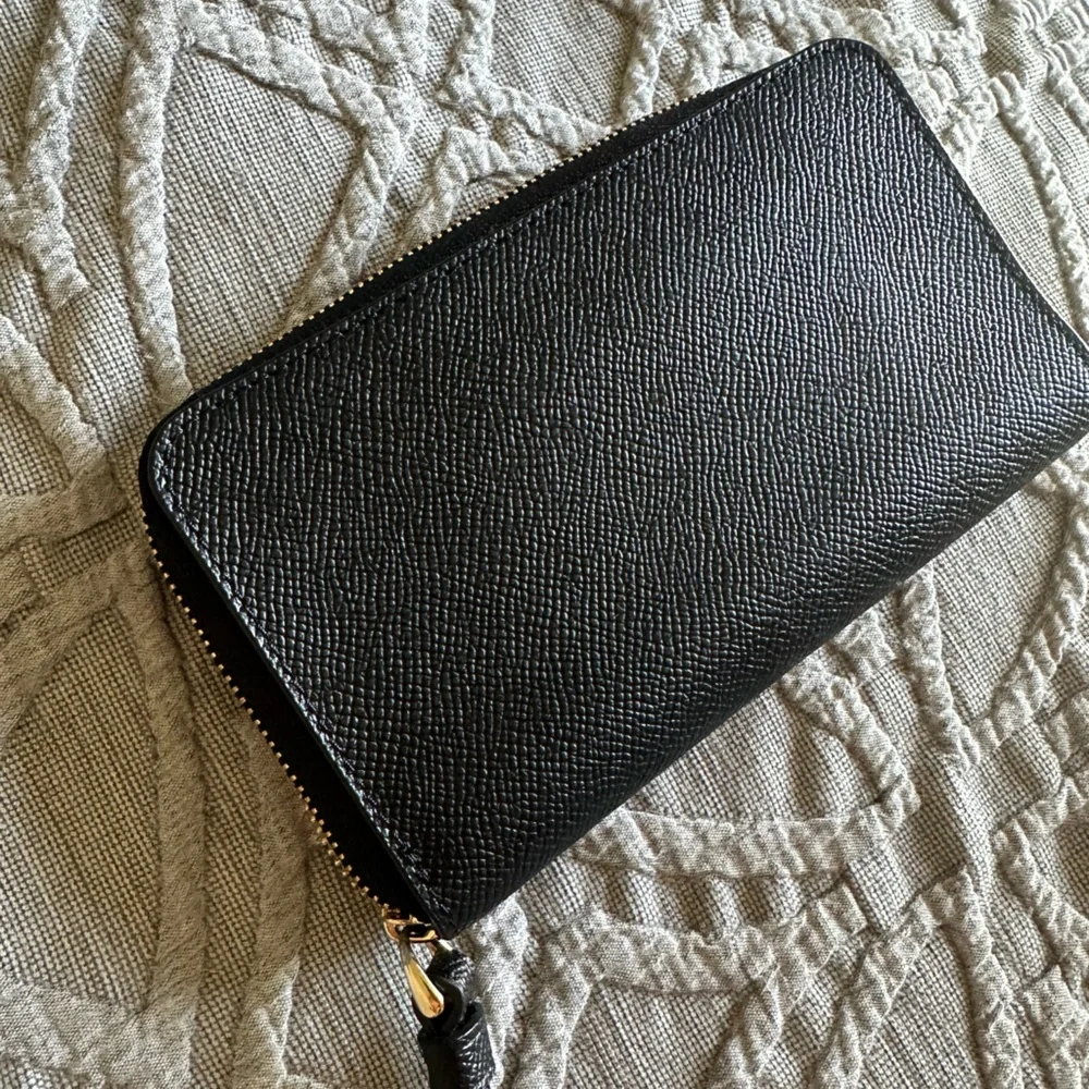 Coach wristlet zip around black pebble wallet